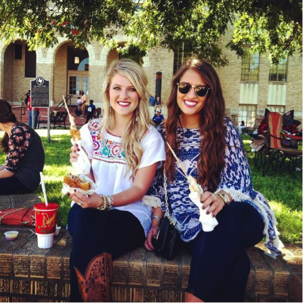 Ilissa & Bethany as they eat on the square while watching Audrey on the carnival rides